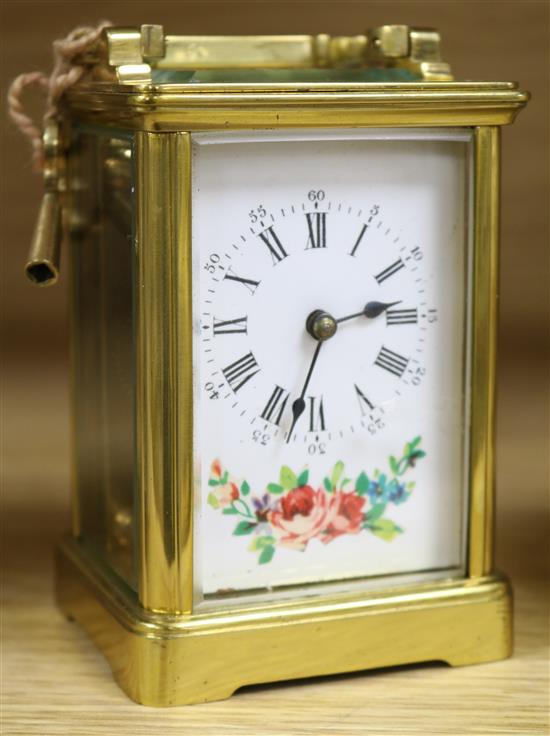 A late 19th Century French brass cased carriage timepiece with floral painted enamelled dial